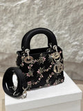 Lady Dior small black silk embroidery bag with silver hardware